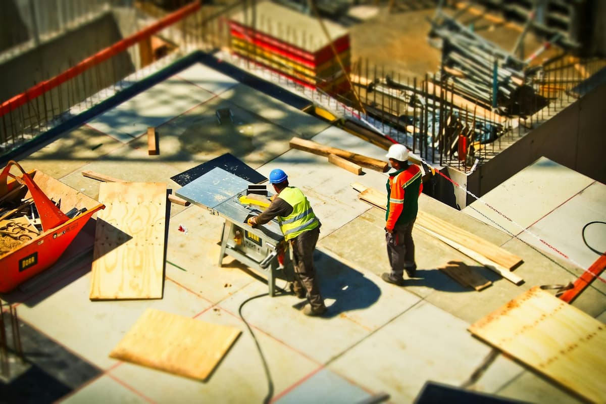 Construction site with workers and equipment — construction industry operations