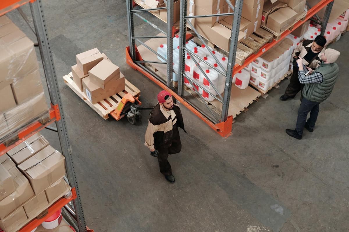 Modern warehouse with organized shelving and inventory boxes — wholesale and retail operations